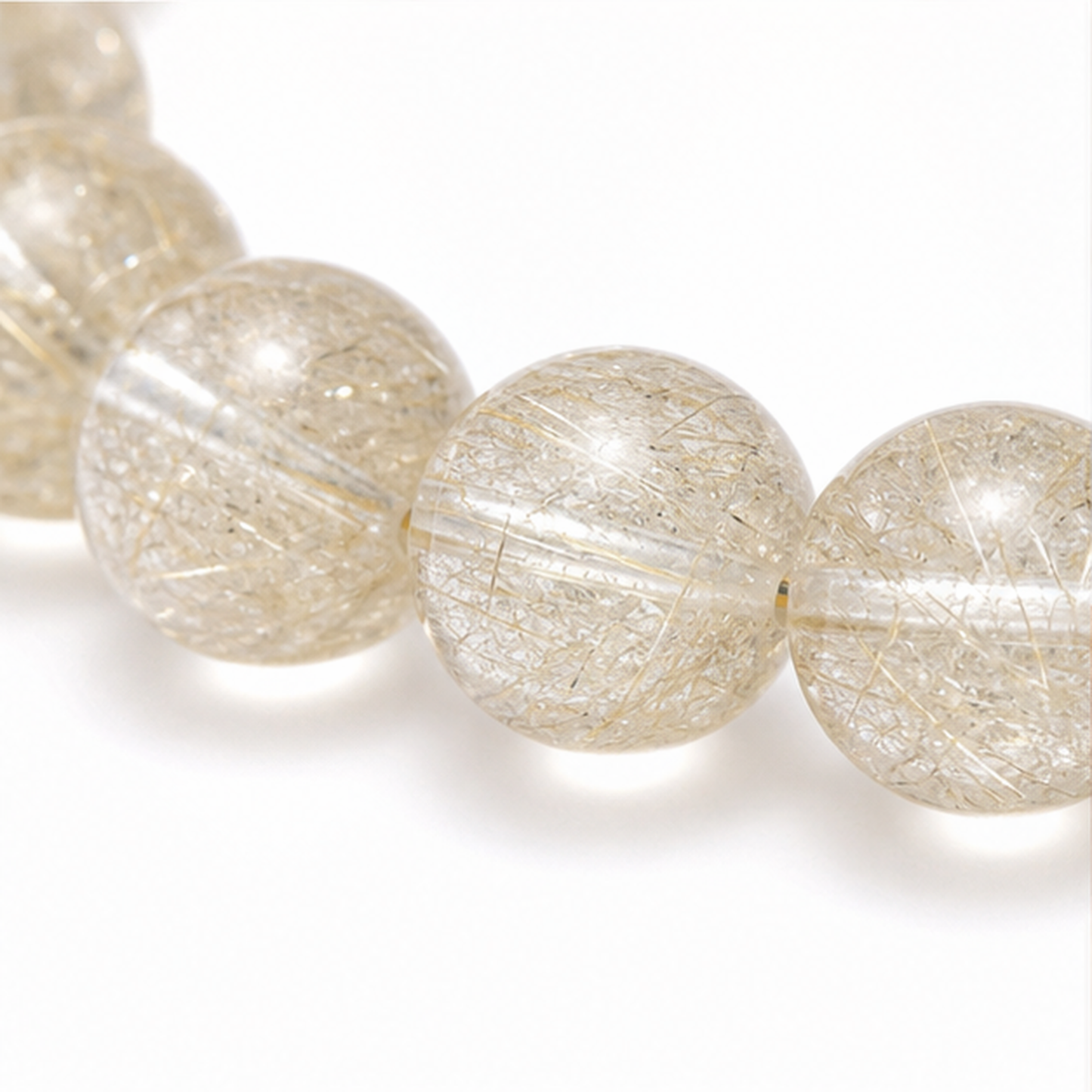 Close-up of Golden Rabbit Hair Quartz bead colour and surface detail