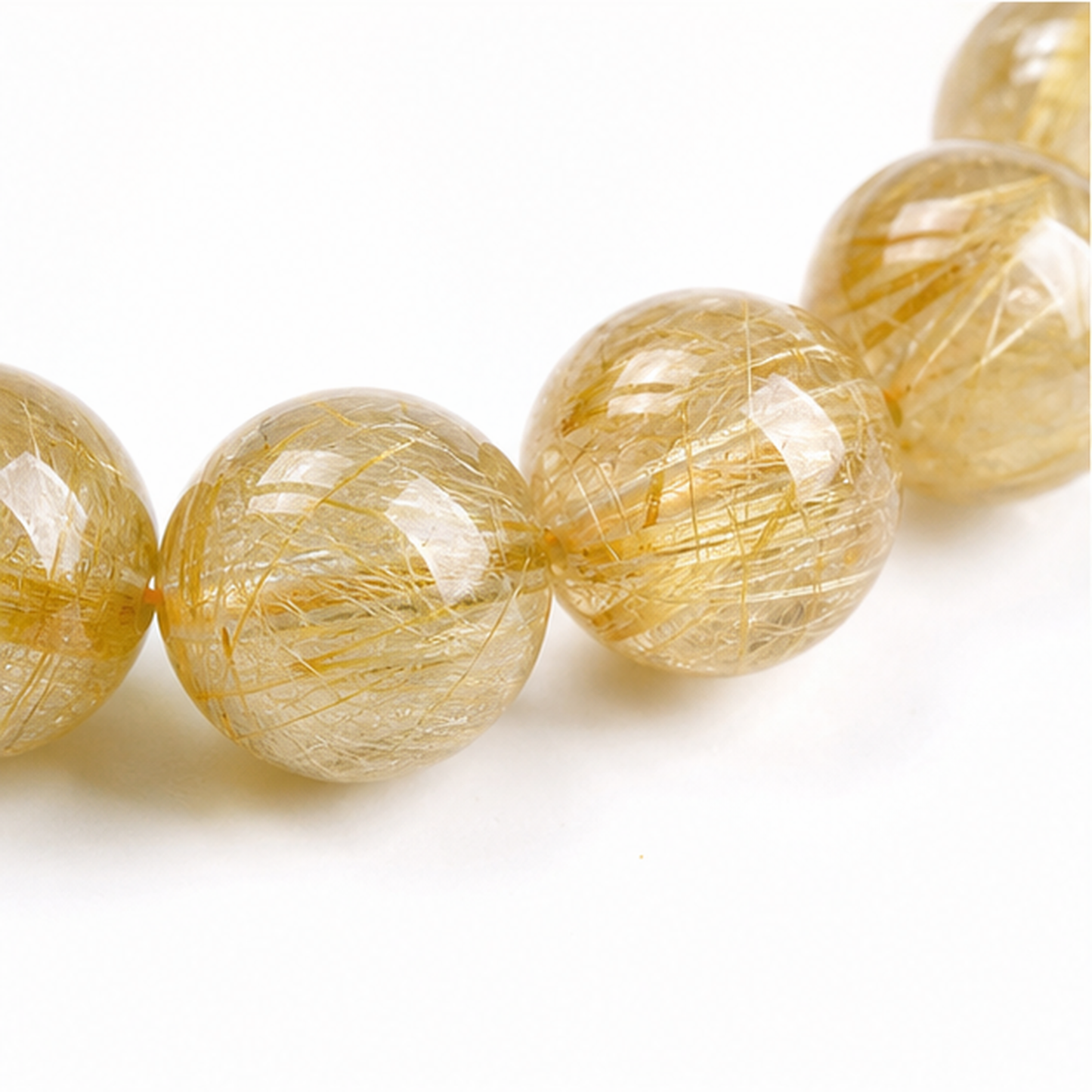 Close-up of Venus Hair Quartz bead colour and surface detail