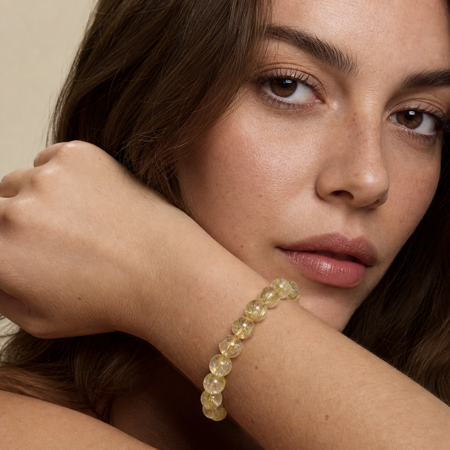 Venus Hair Quartz worn by a woman with the bracelet in focus