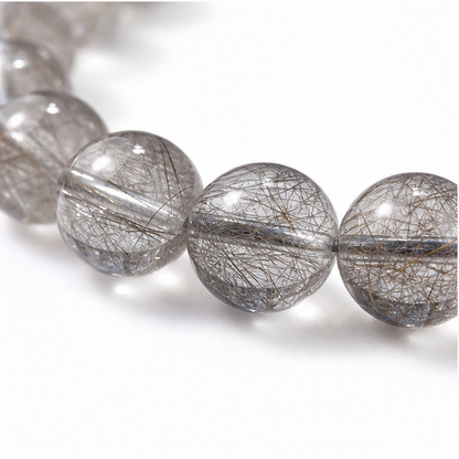Close-up of Silver Rutilated Quartz bead colour and surface detail