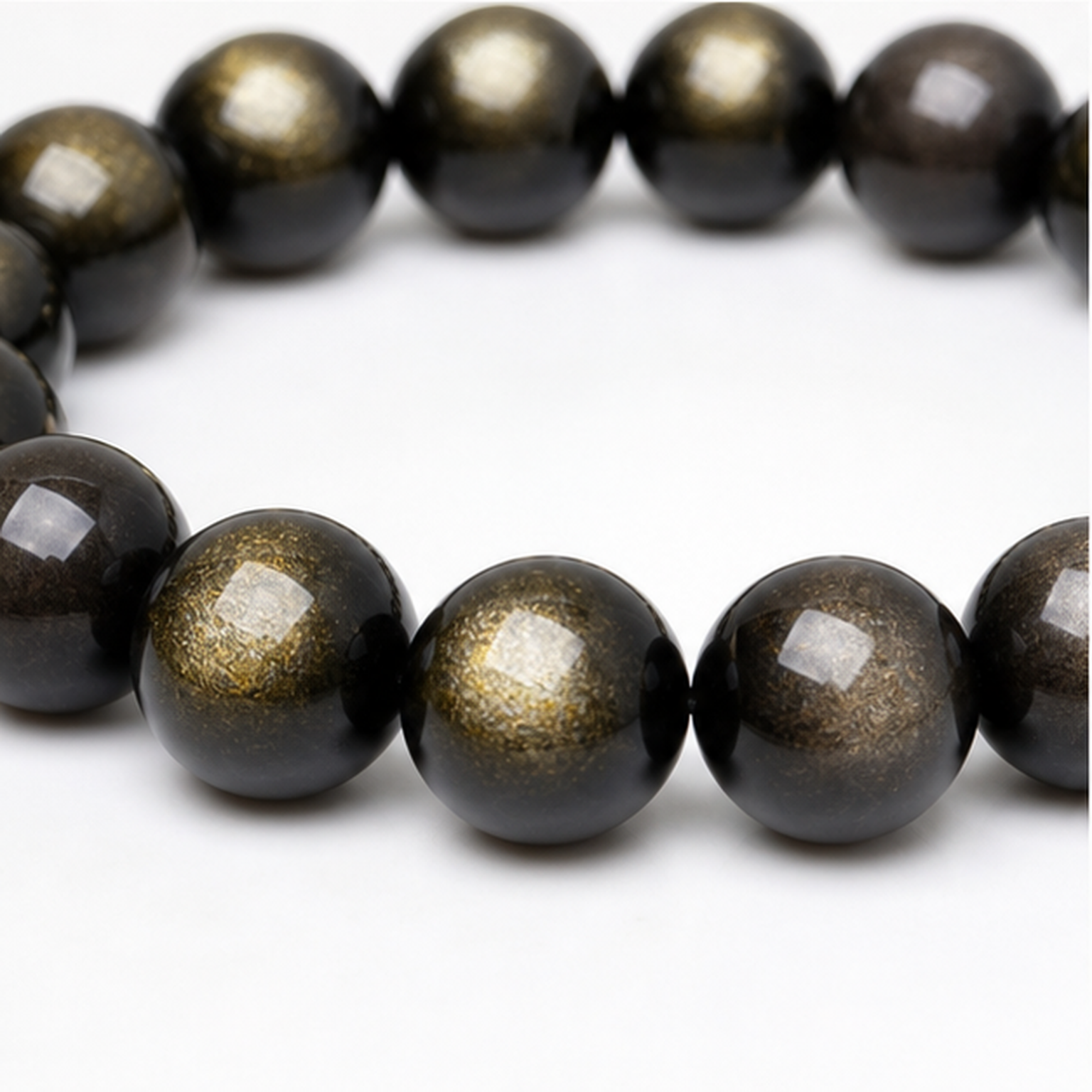 Close-up of Gold Sheen Obsidian bead colour and surface detail
