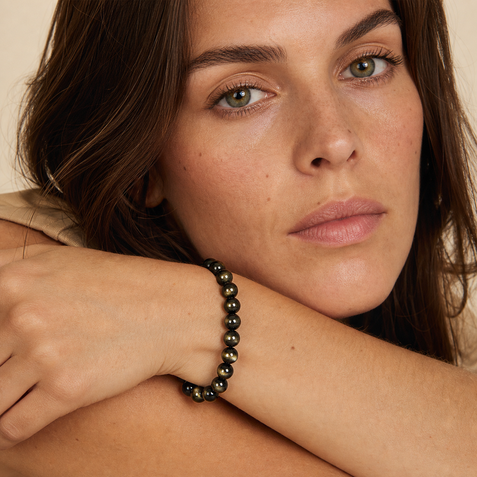 Gold Sheen Obsidian styled on a woman in a close product view