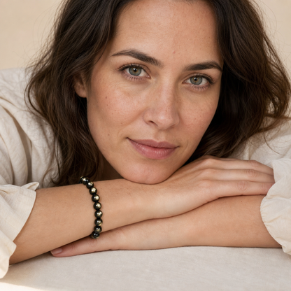 Gold Sheen Obsidian worn by a woman with the bracelet in focus
