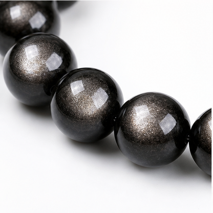 Close-up of Silver Sheen Obsidian bead colour and surface detail