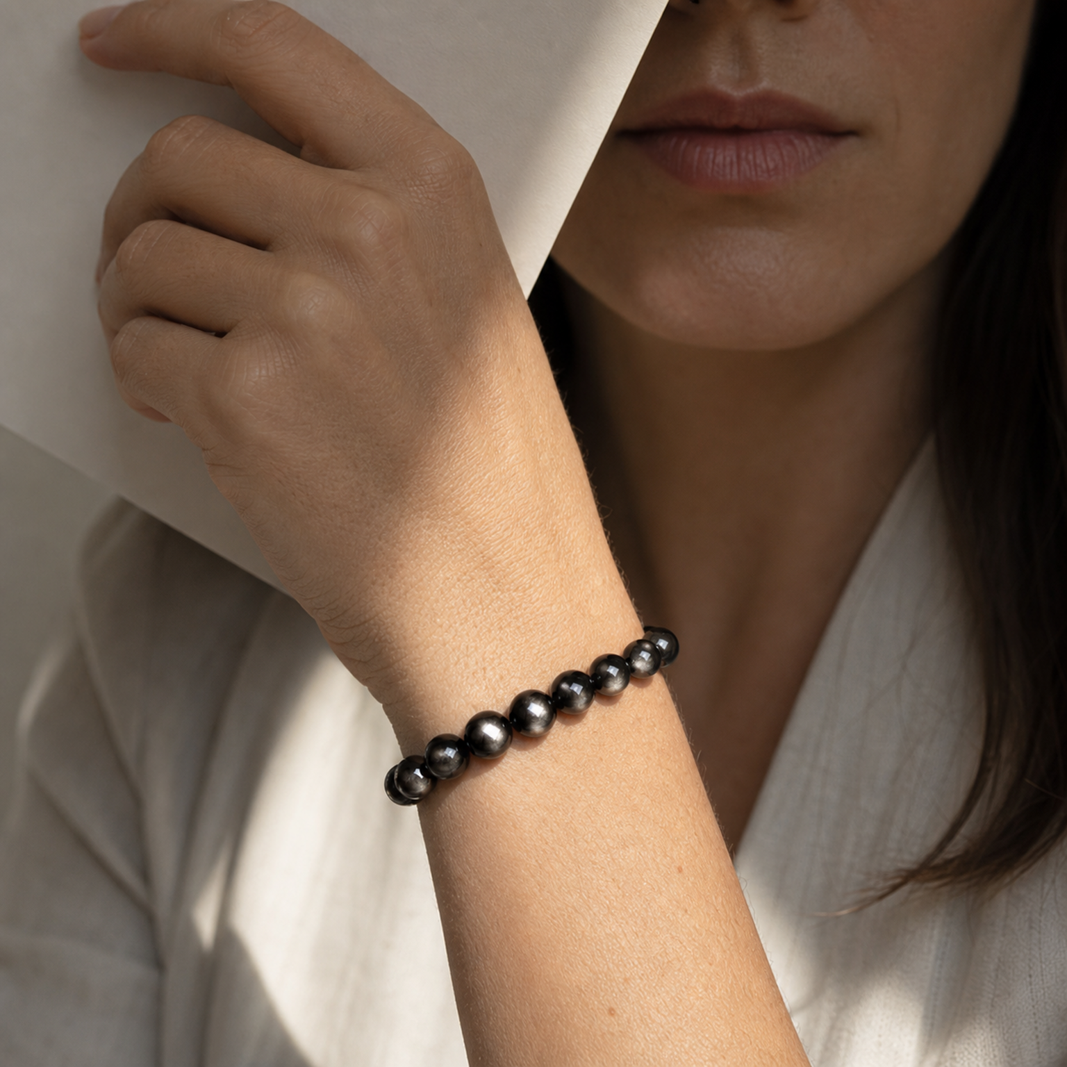 Cropped wrist view of Silver Sheen Obsidian