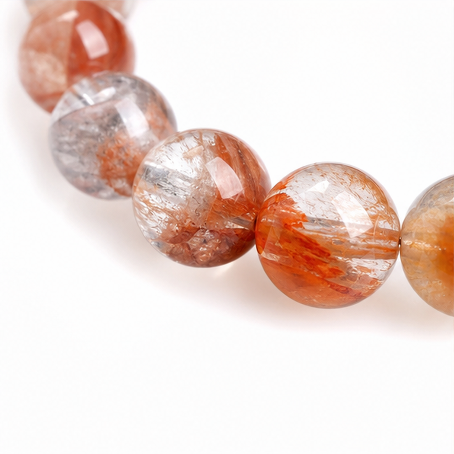 Close-up of Phantom Hematoid Quartz bead colour and surface detail