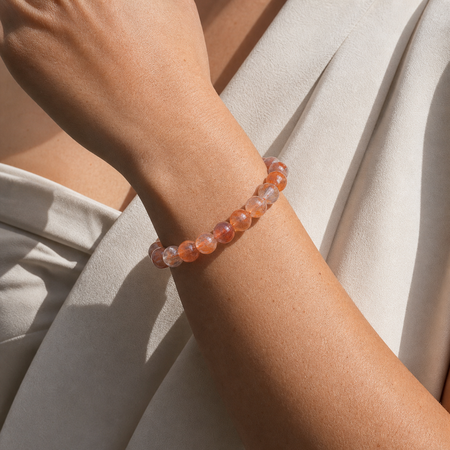 Close wrist detail of Phantom Hematoid Quartz
