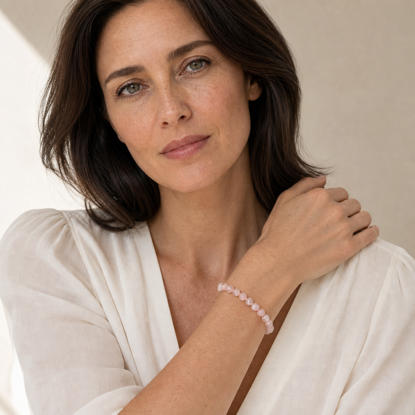 Cherry Blossom Agate worn by a woman with the bracelet in focus