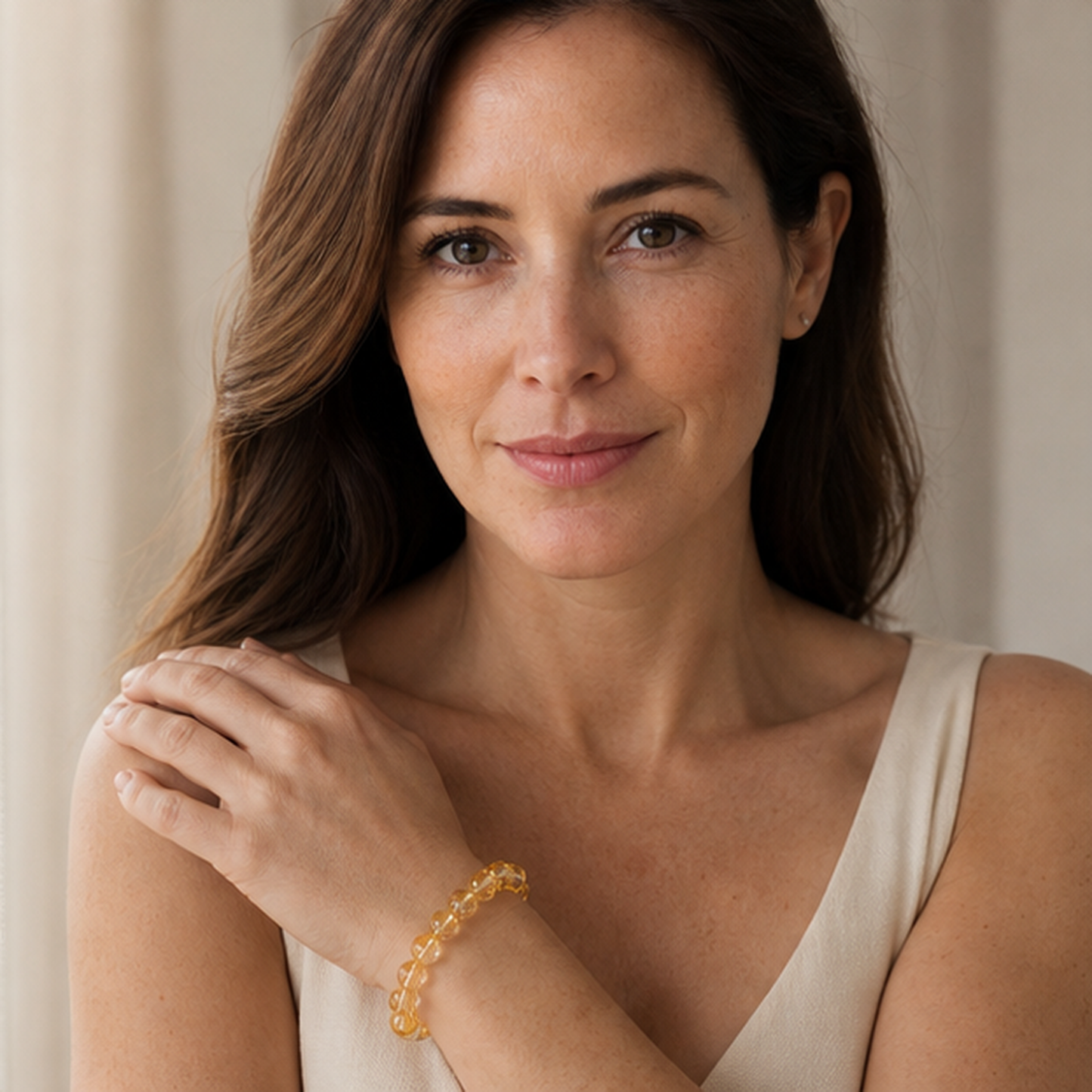Yellow Azeztulite styled on a woman in a close product view