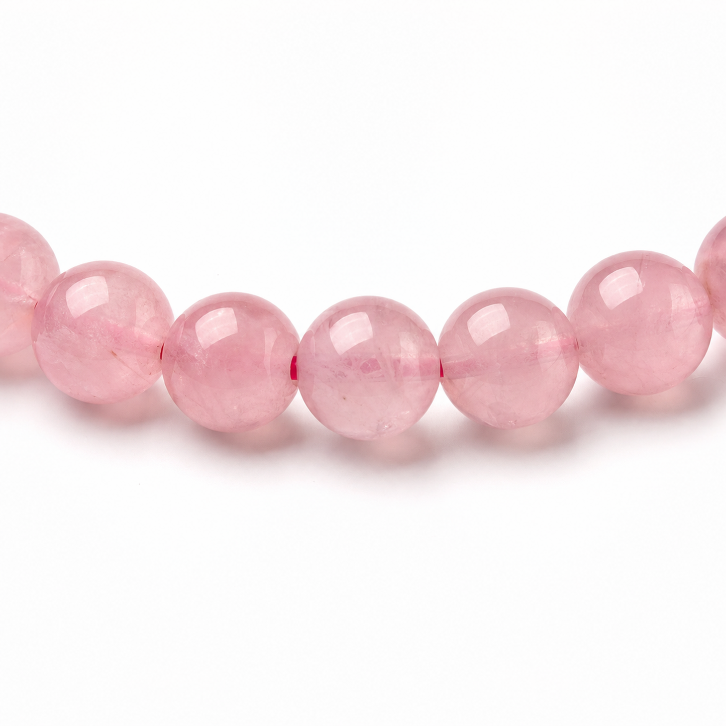 Close-up of Madagascar Rose Quartz bead colour and surface detail