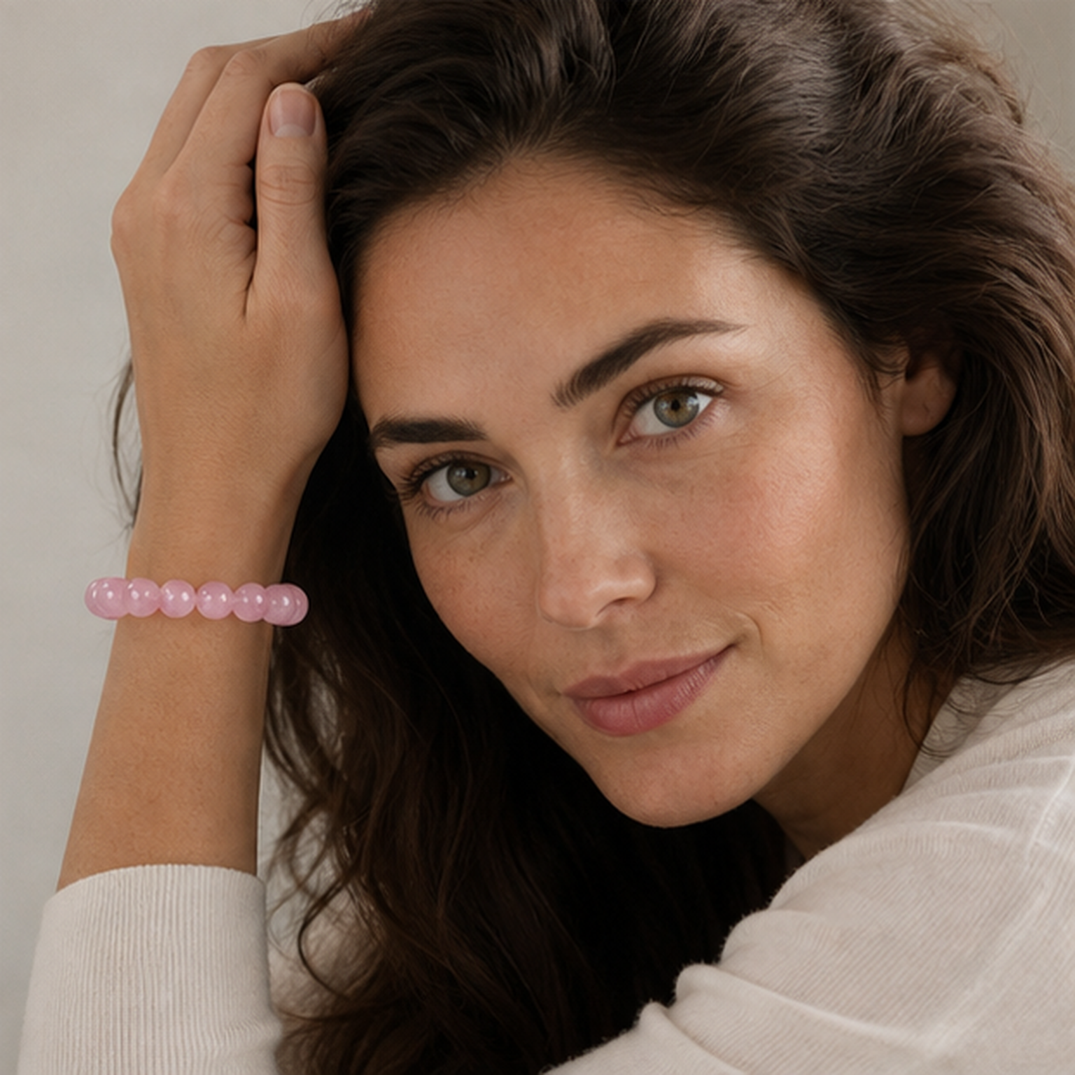 Madagascar Rose Quartz worn by a woman with the bracelet in focus