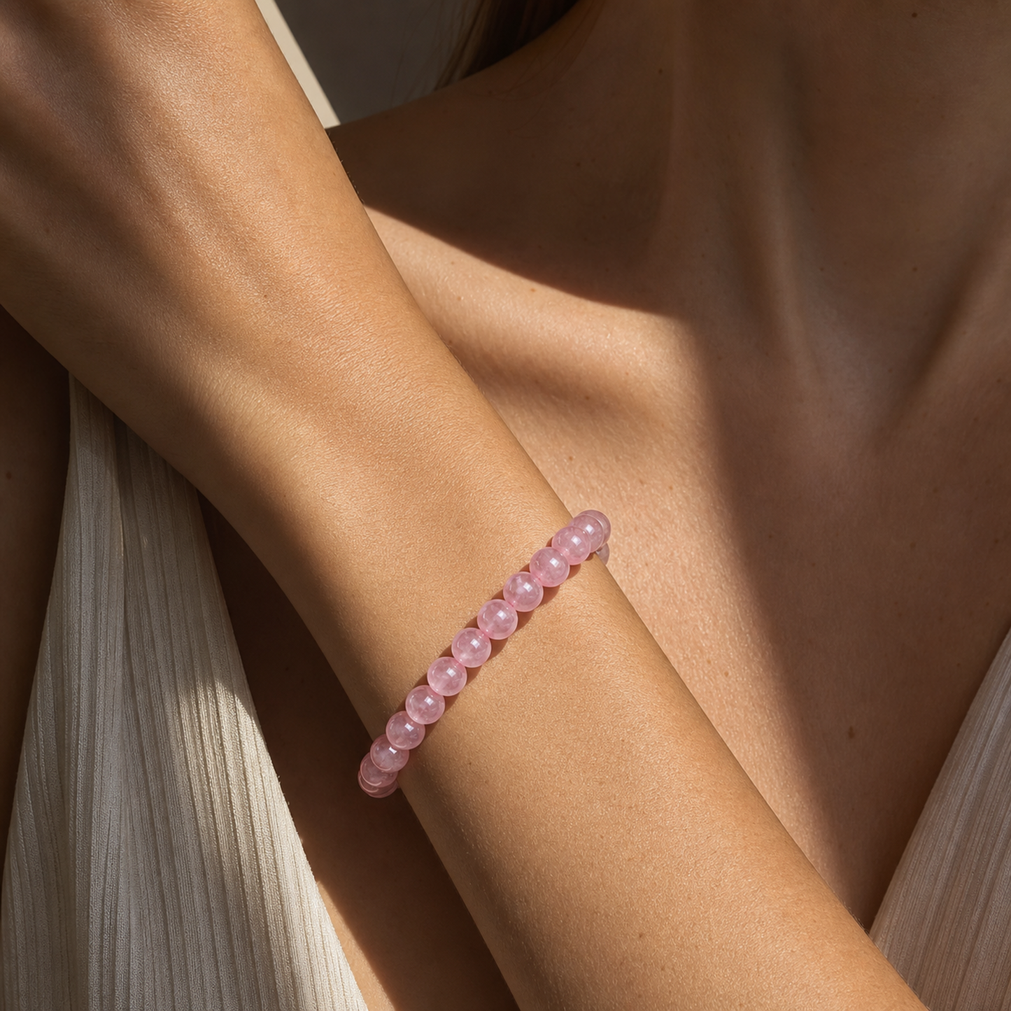 Close wrist detail of Madagascar Rose Quartz