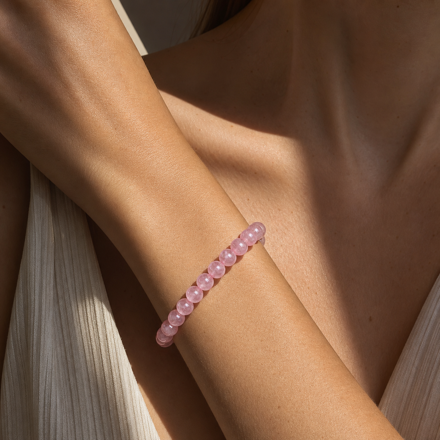 Close wrist detail of Madagascar Rose Quartz
