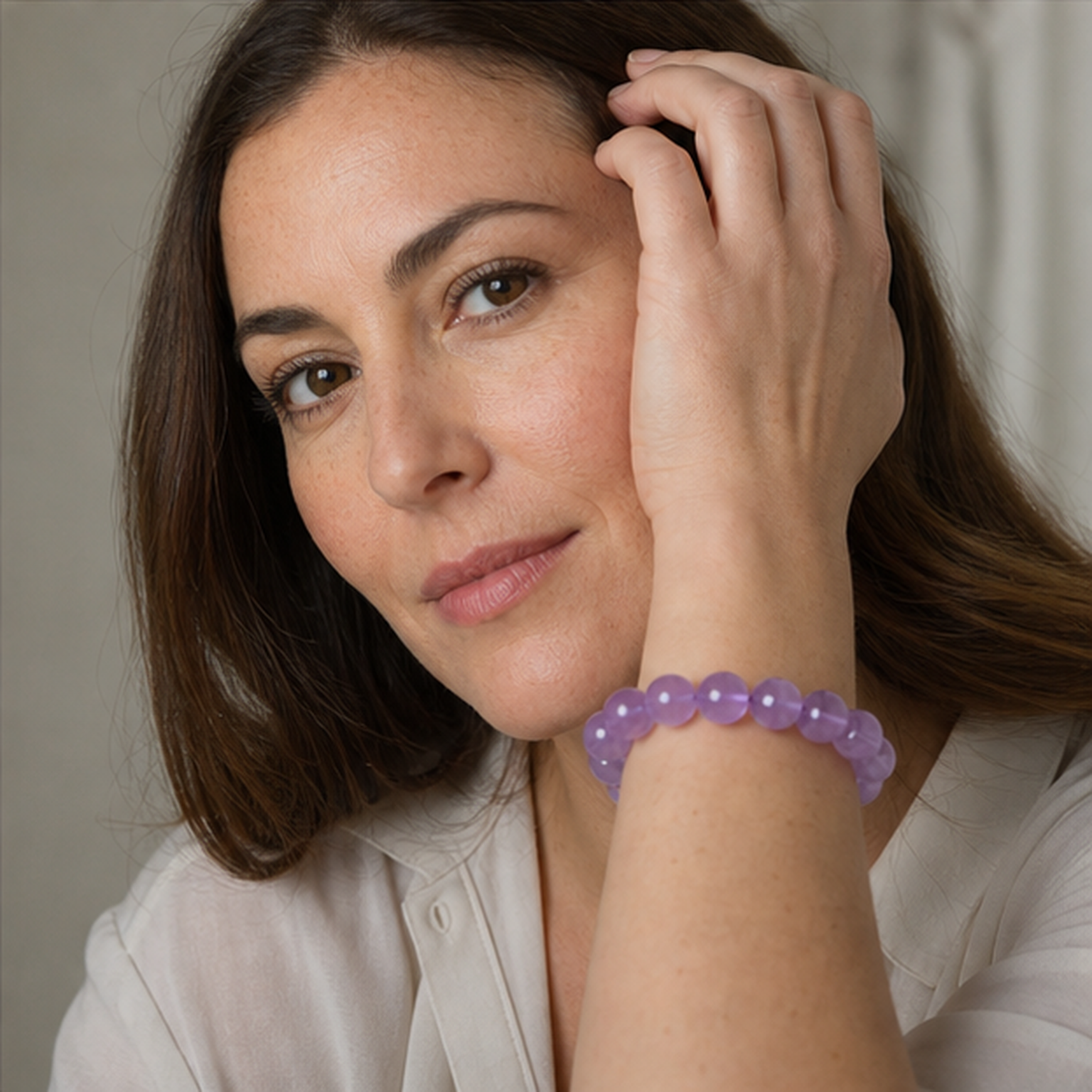Light Amethyst worn by a woman with the bracelet in focus