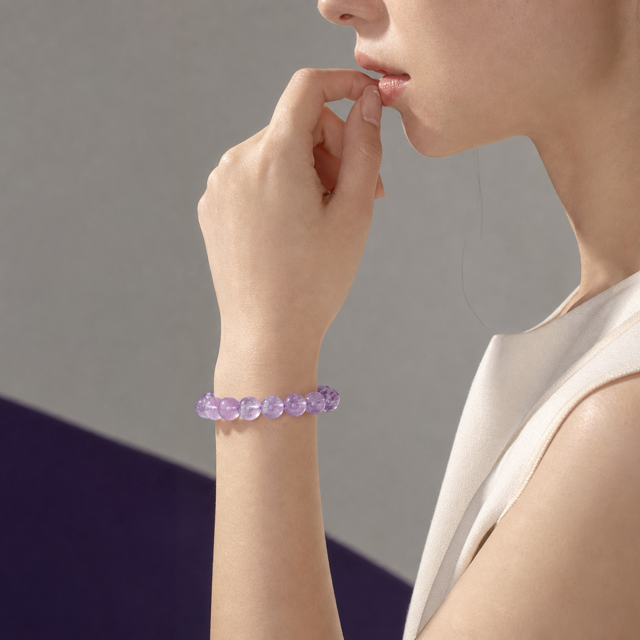 Kunzite bracelet worn on a model's wrist